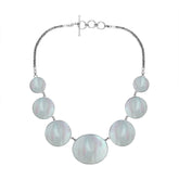 Women’s sterling silver necklace with Mother of Pearl discs and Bali-inspired accents.